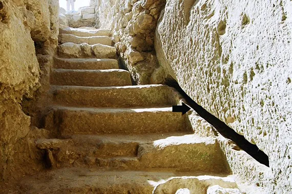  narrow channel hewn along the staircase that would have carried water into the ritual bath.